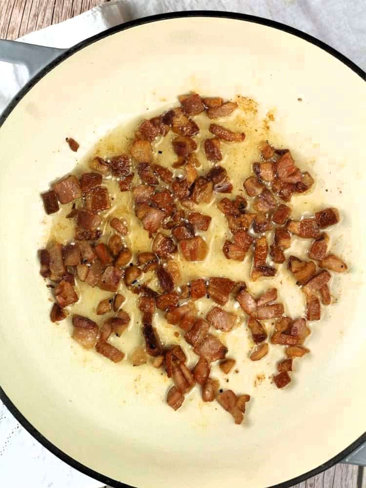 Sautéed pancetta in skillet for pistachio pasta recipe.