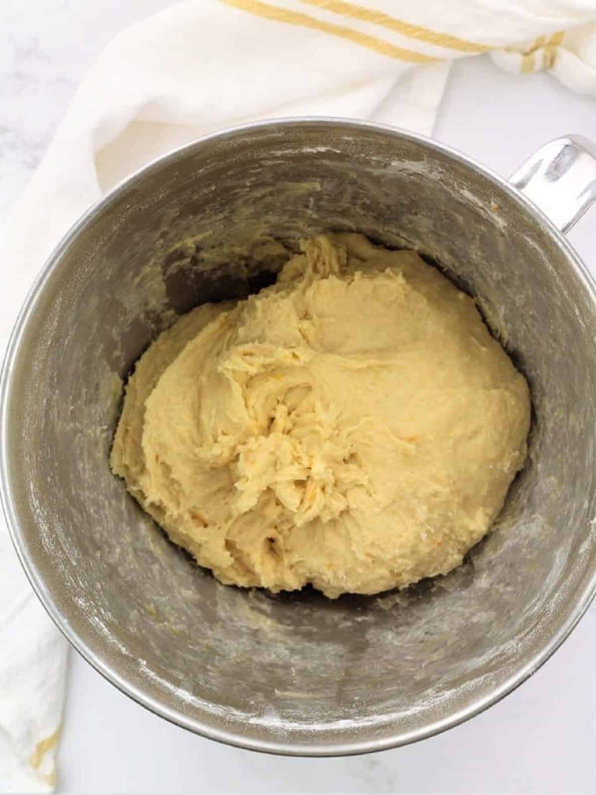Dough hook kneaded Easter bread dough in food processor bowl.