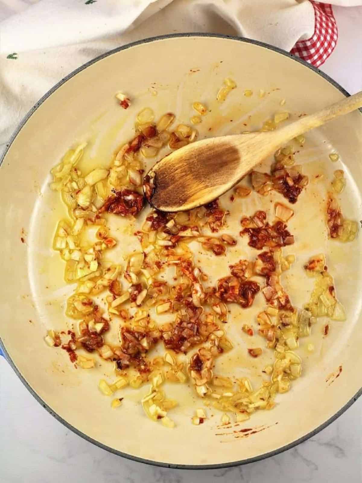 Sautéed onion and garlic with tomato paste stirred in.