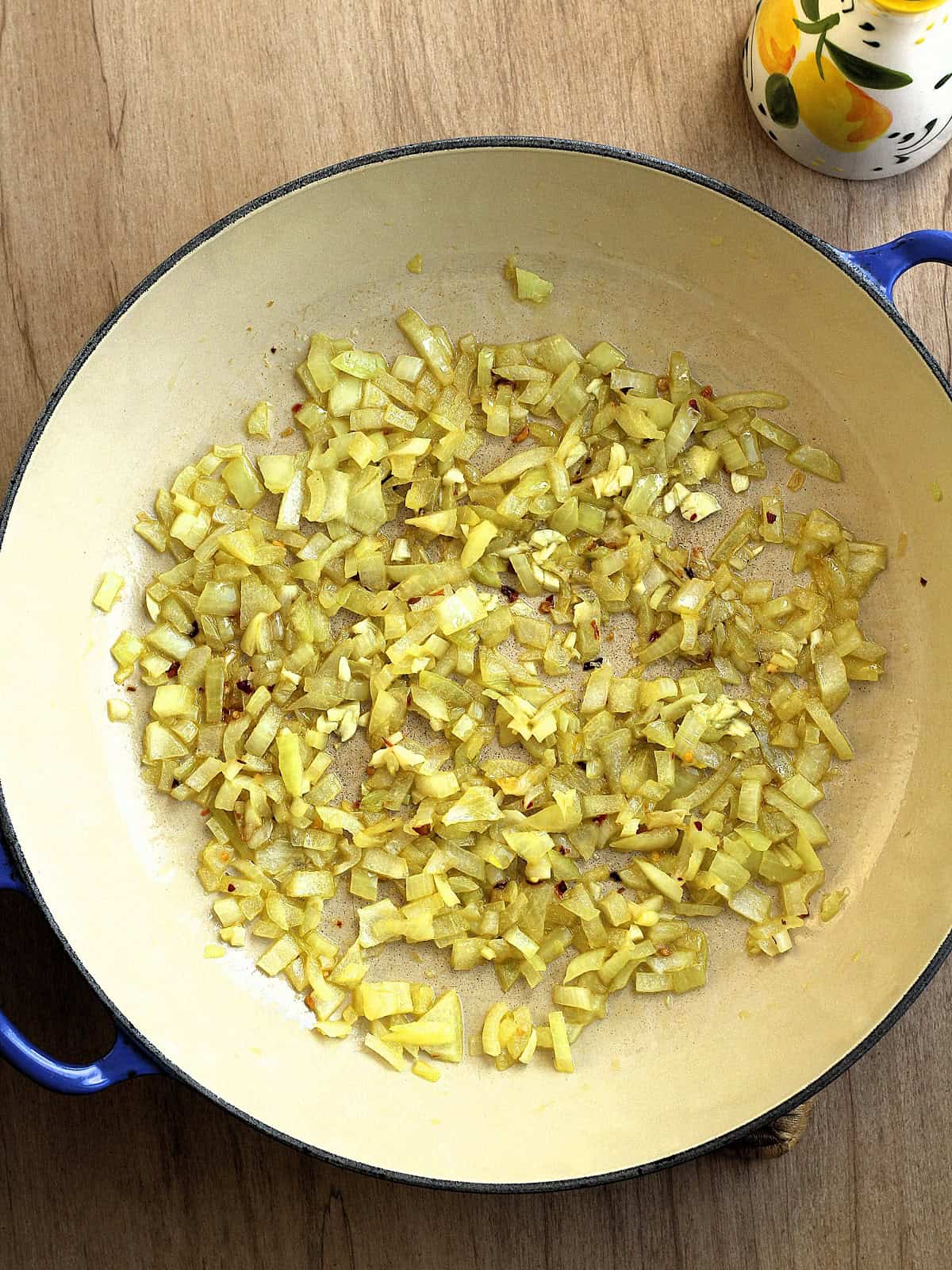 Diced onion sautéed in large skillet along with red pepper flakes and minced garlic.