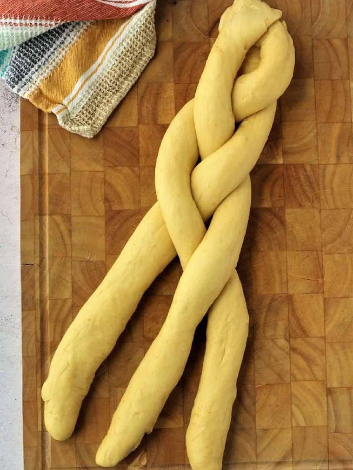 Brioche dough ropes braided together.