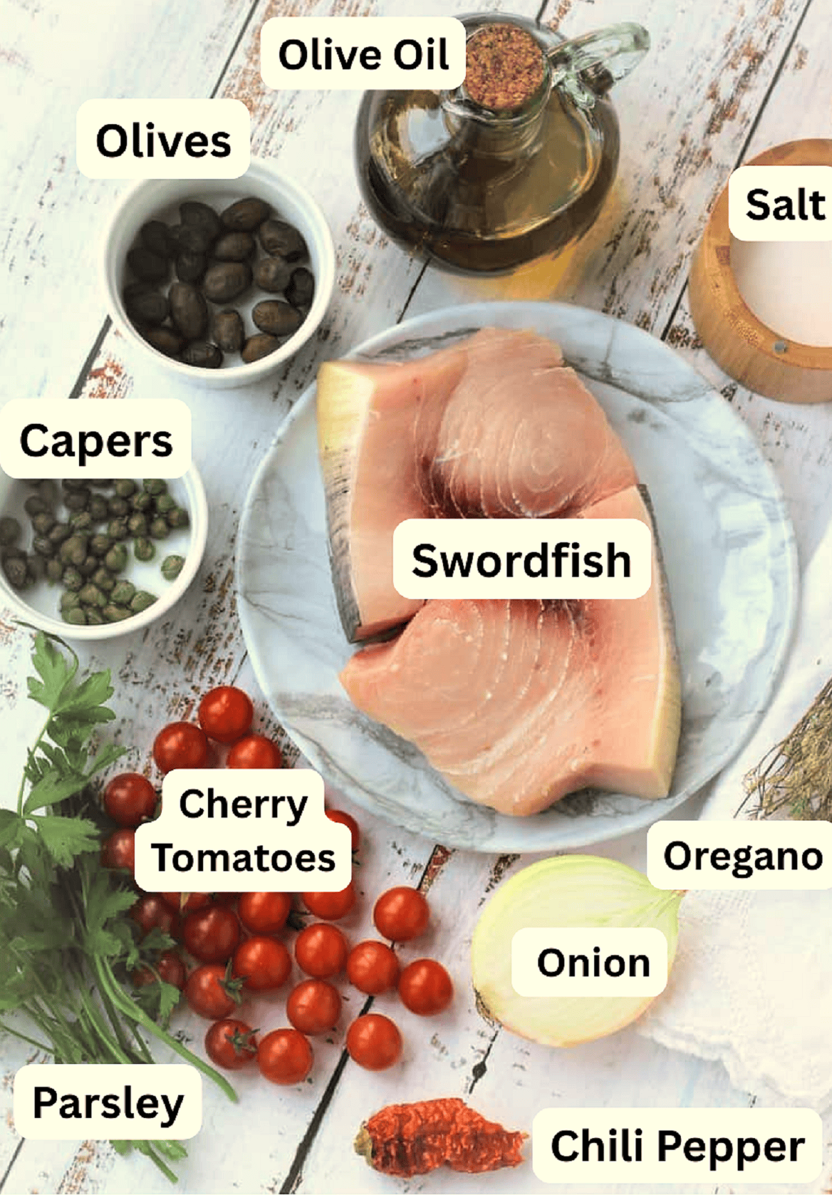 Swordfish, tomatoes, olives, capers, onion, oregano, chili pepper, salt, and olive oil.
