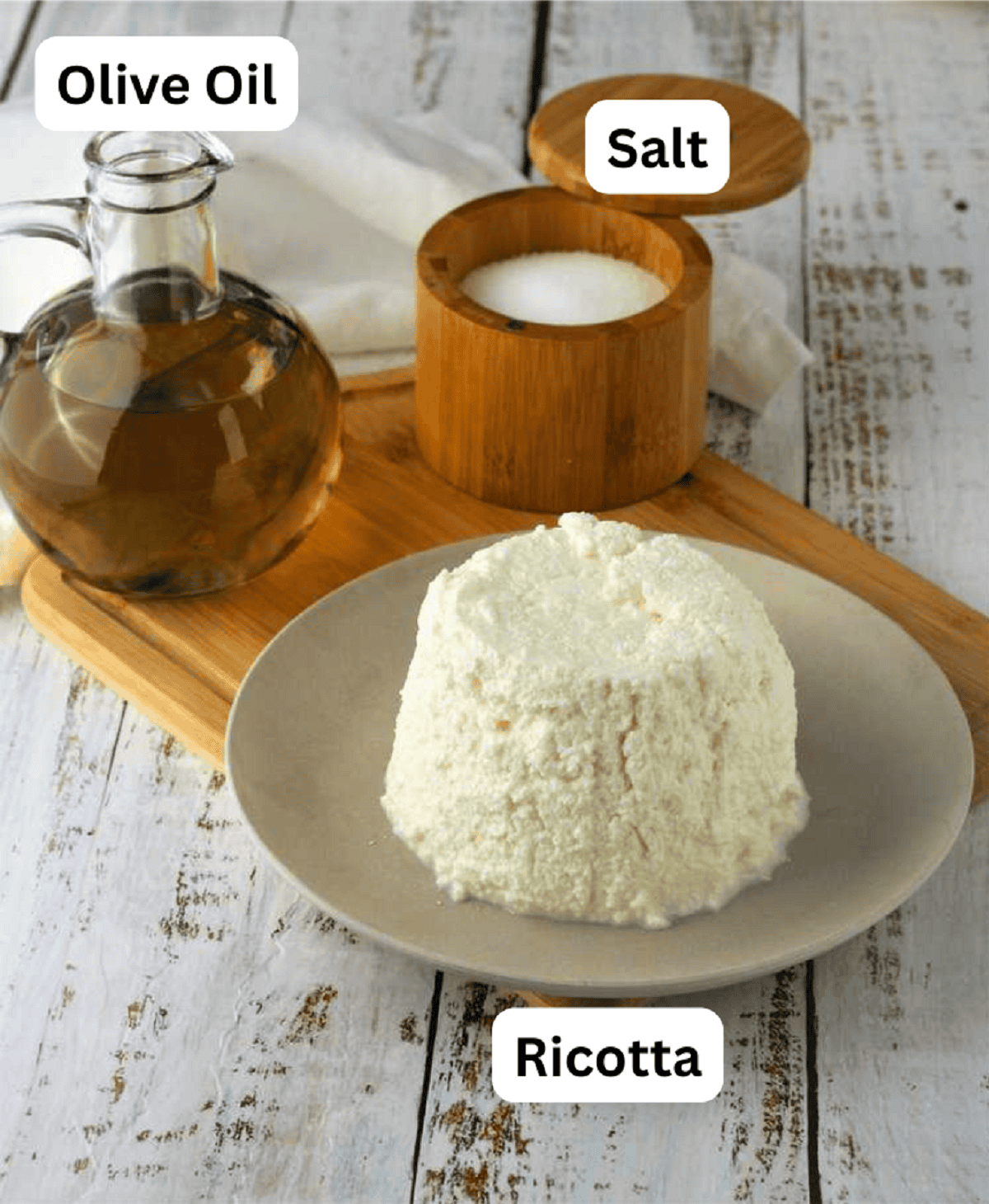 Ricotta, salt and olive oil for baked ricotta recipe.