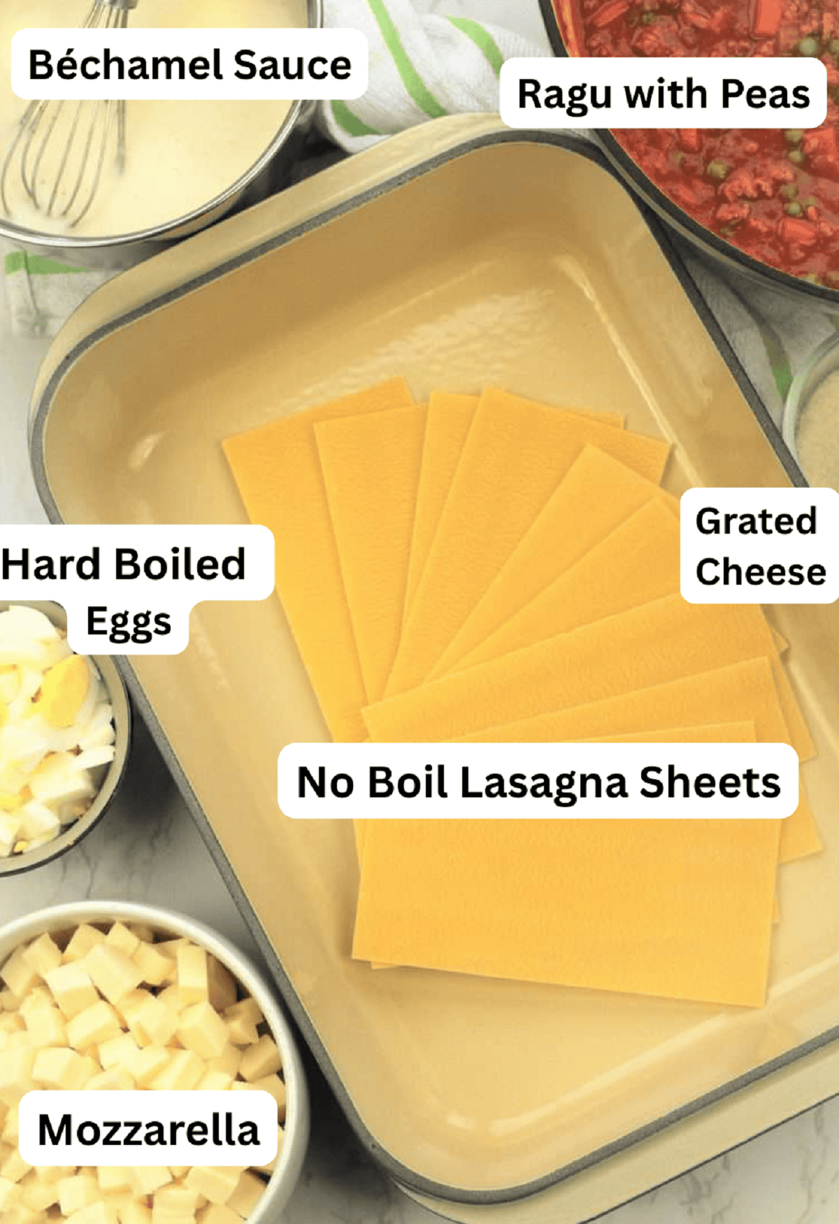 Lasagna sheets, meat sauce, mozzarella, hard boiled eggs, grated cheese and bechamel sauce for Sicilian lasagna.
