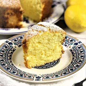 Slice of lemony nonna's sponge cake (ciambella) topped with powdered sugar.