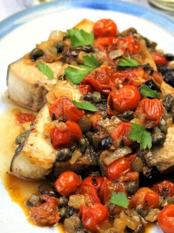 Sicilian swordfish recipe with tomatoes, olives and caper sauce.