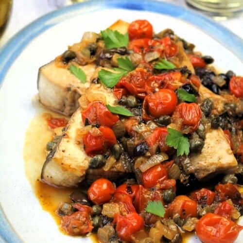 Sicilian swordfish recipe with tomatoes, olives and caper sauce.