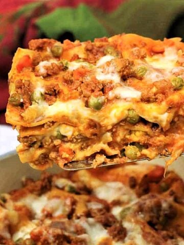 Slice of Sicilian lasagna picked up with a spatula.