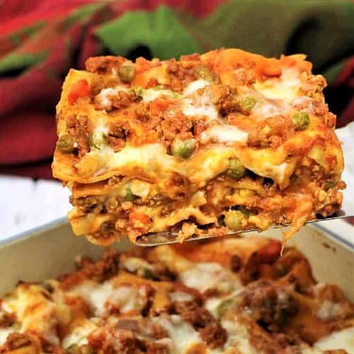 Slice of Sicilian lasagna picked up with a spatula.