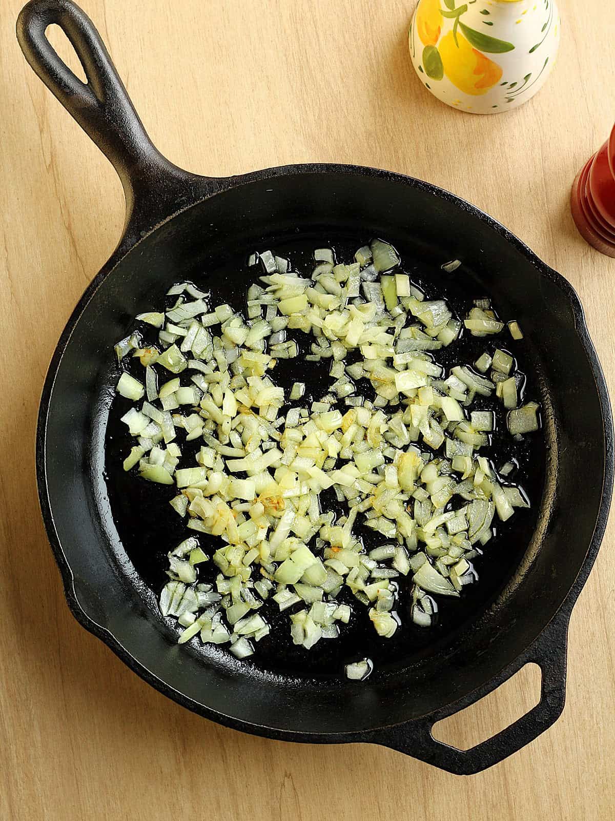 Diced onion sautéed in olive oil in cast iron skillet.