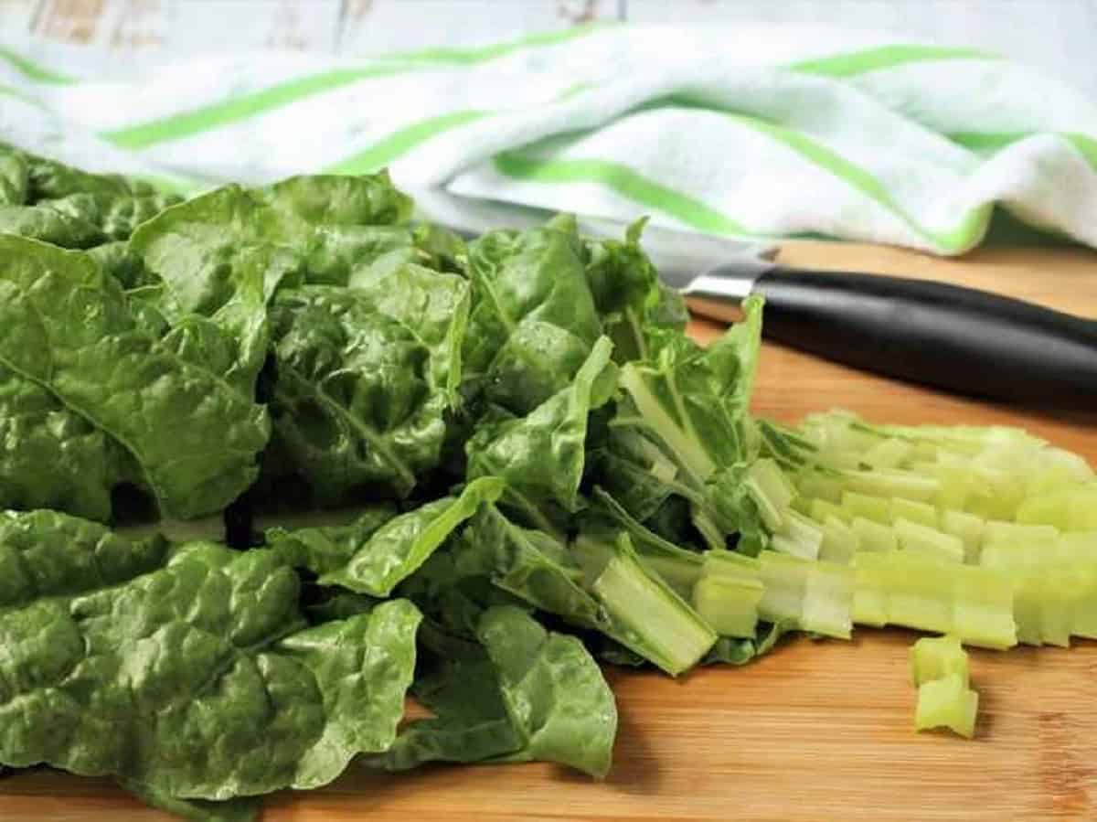Chopped swiss chard leaves for Italian fritter recipe.