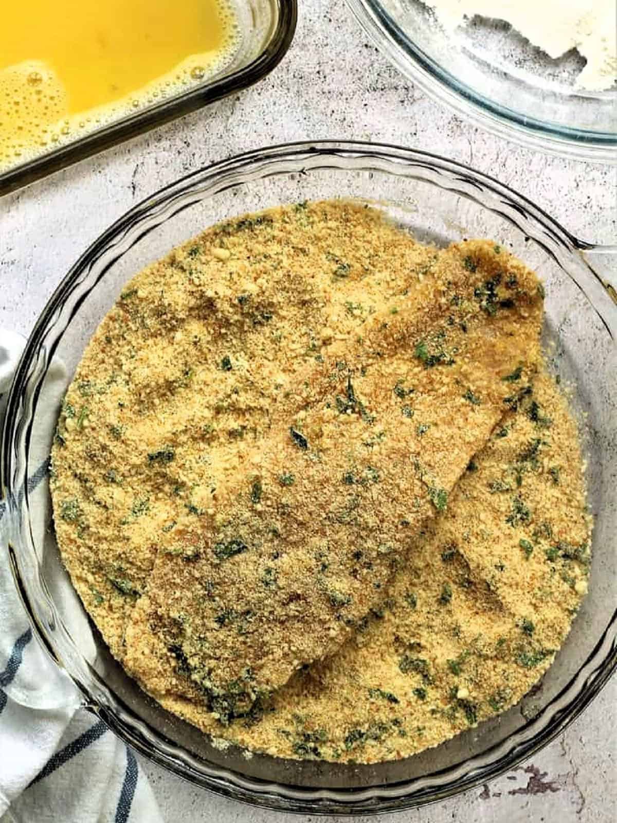 Chicken cutlet dredged in seasoned breadcrumbs.