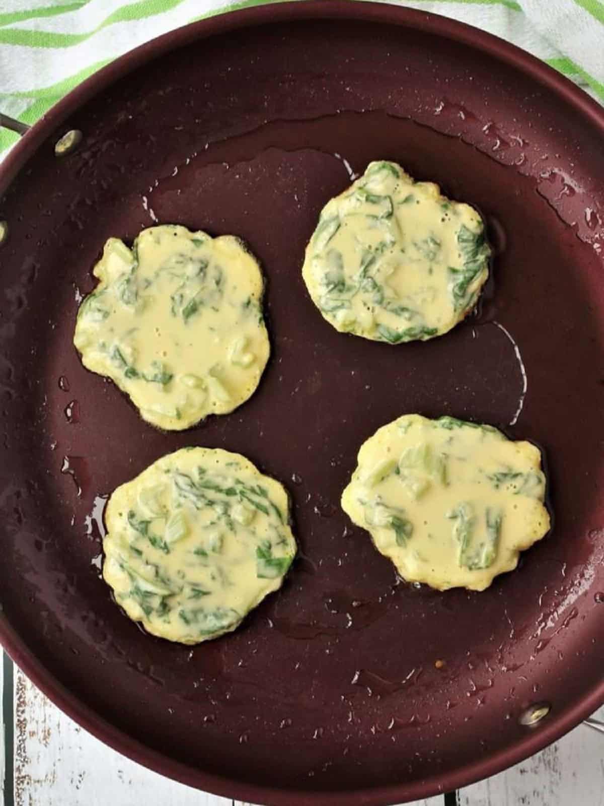 Swiss chard fritters pan fried in oil.