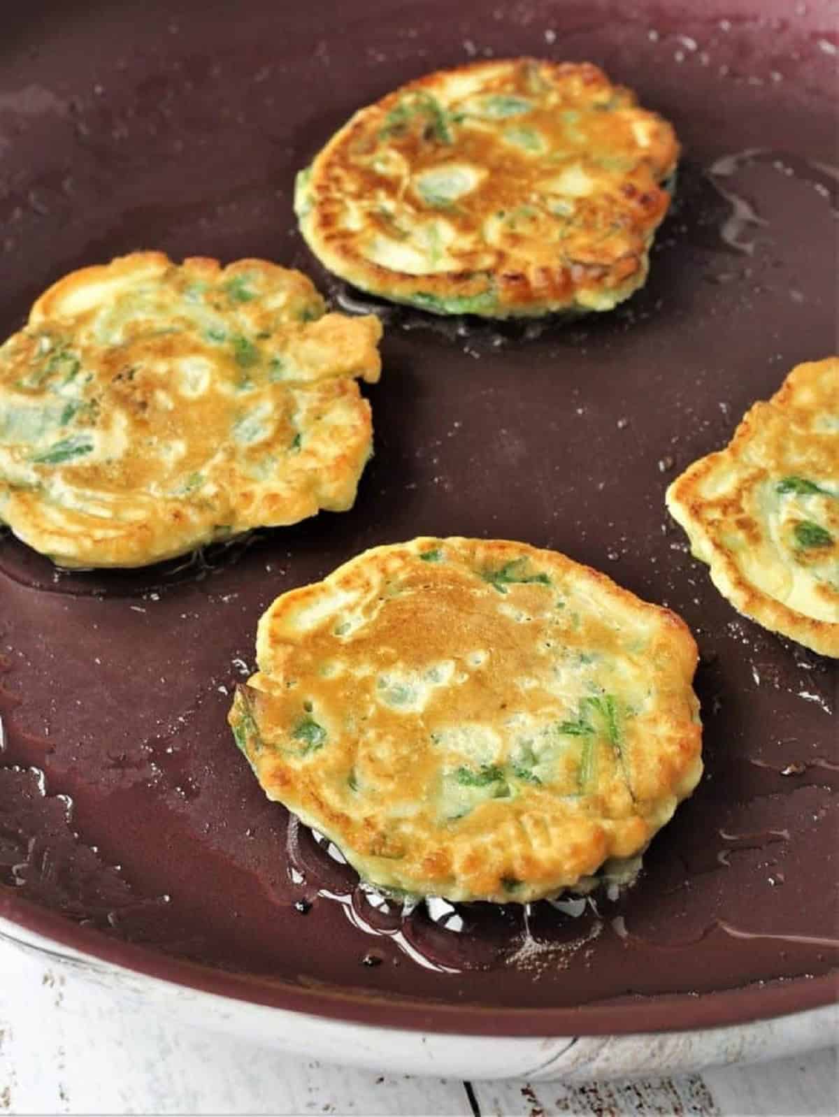 Pan fried swiss chard fritters until golden.