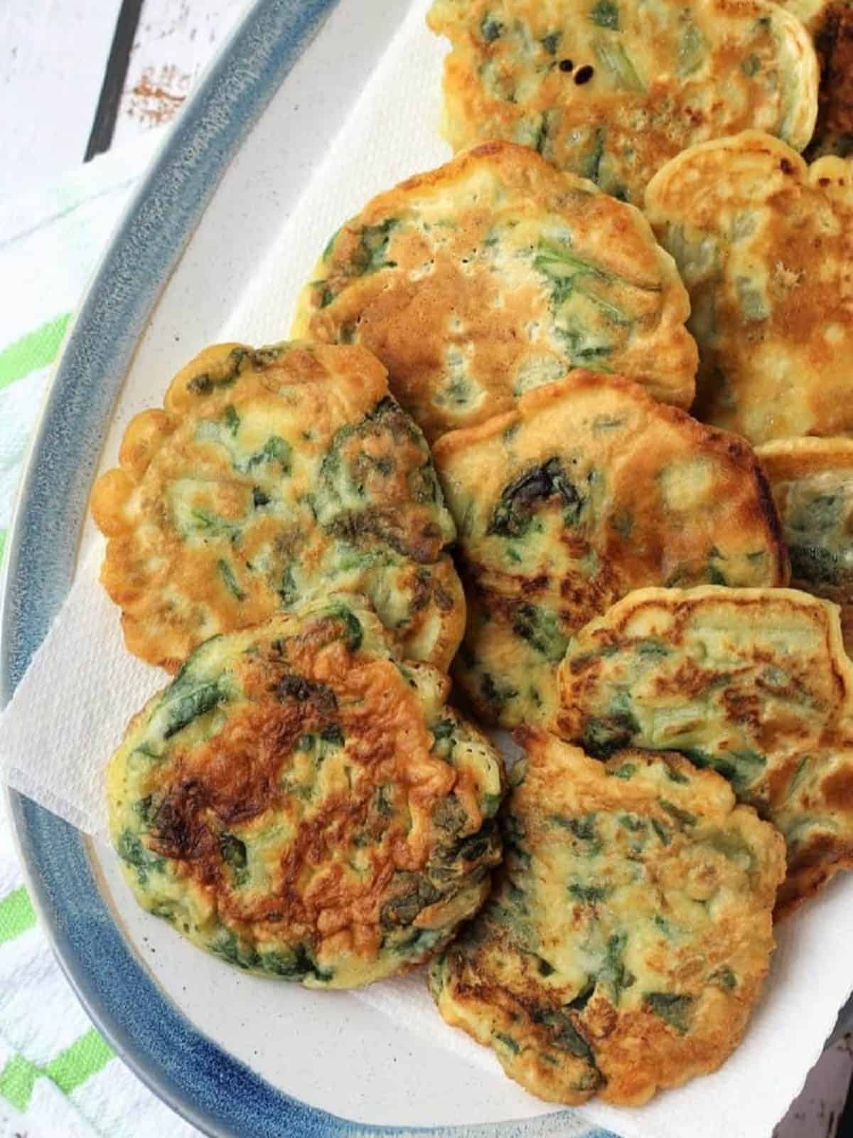 Swiss chard fritters (crispeddi chi giri) on serving plate.