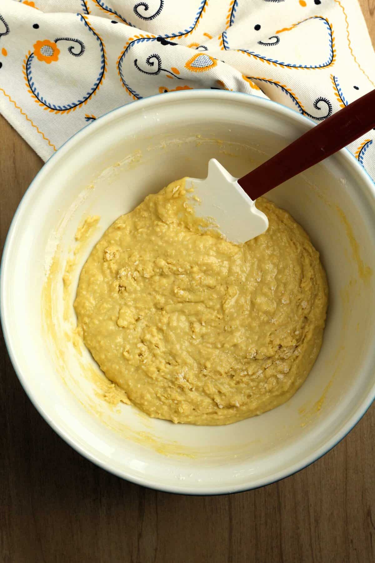 Savory ring cake batter in bowl with spatula.
