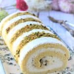 Ricotta pistachio roll cake on plate.