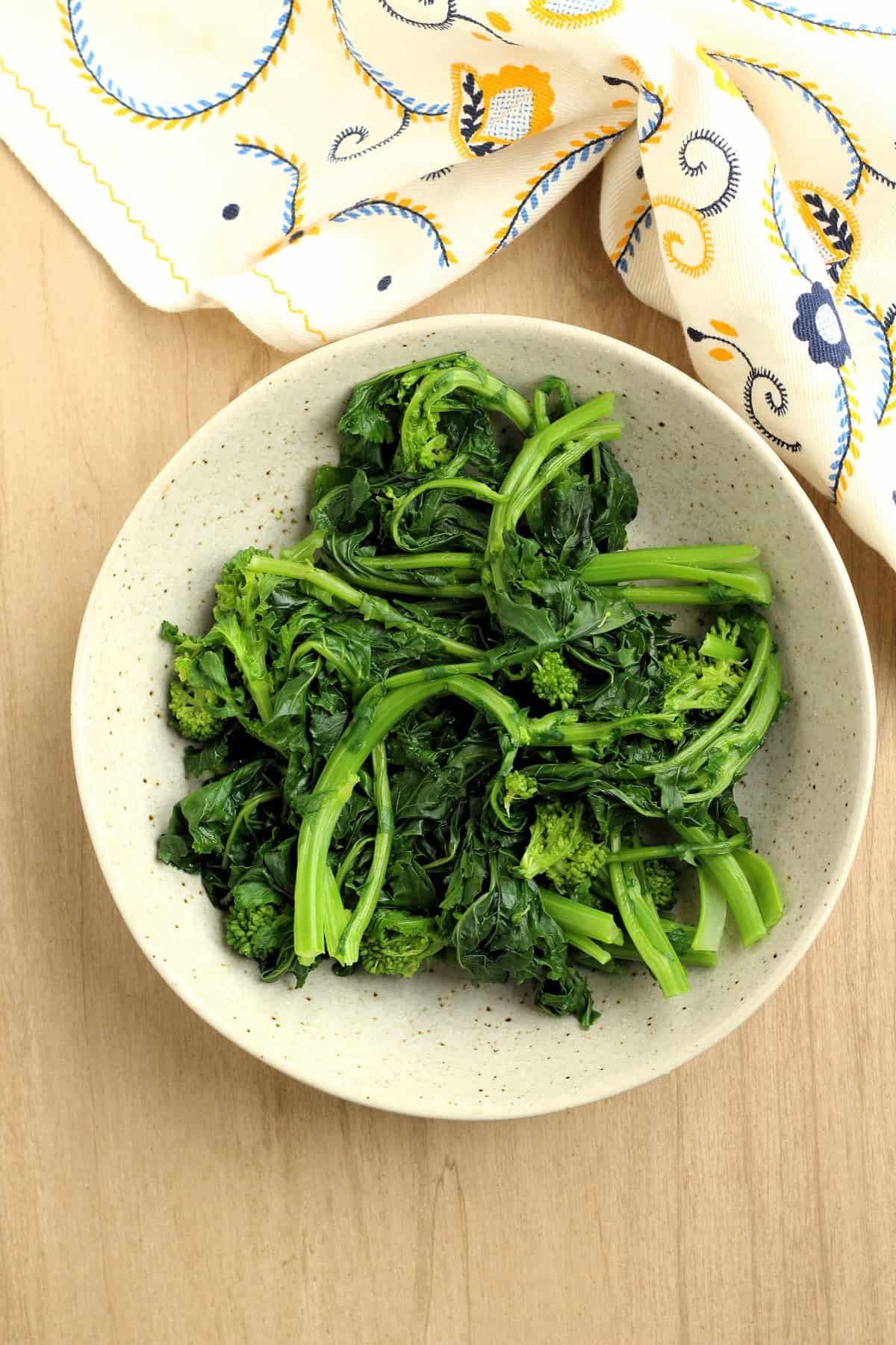 Blanched rapini in bowl for ring cake recipe.