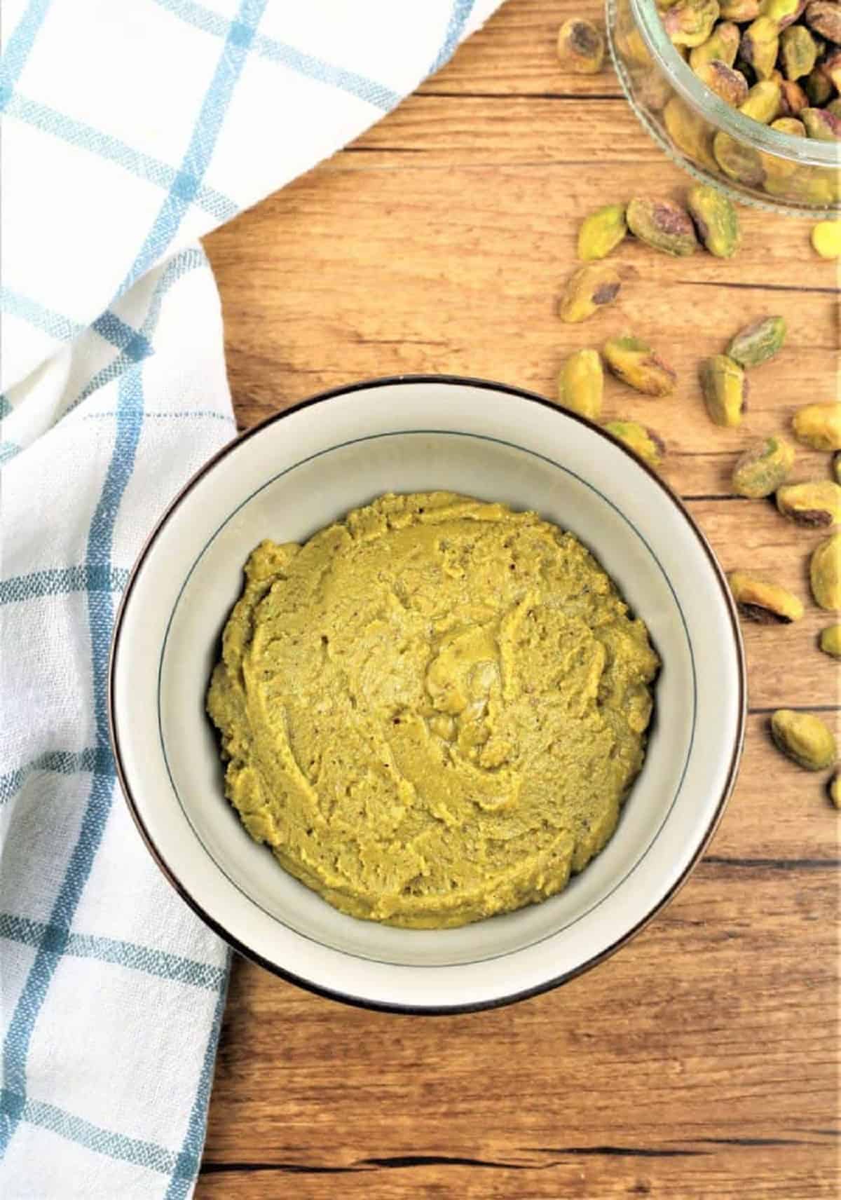 Creamy pistachio butter in small bowl.