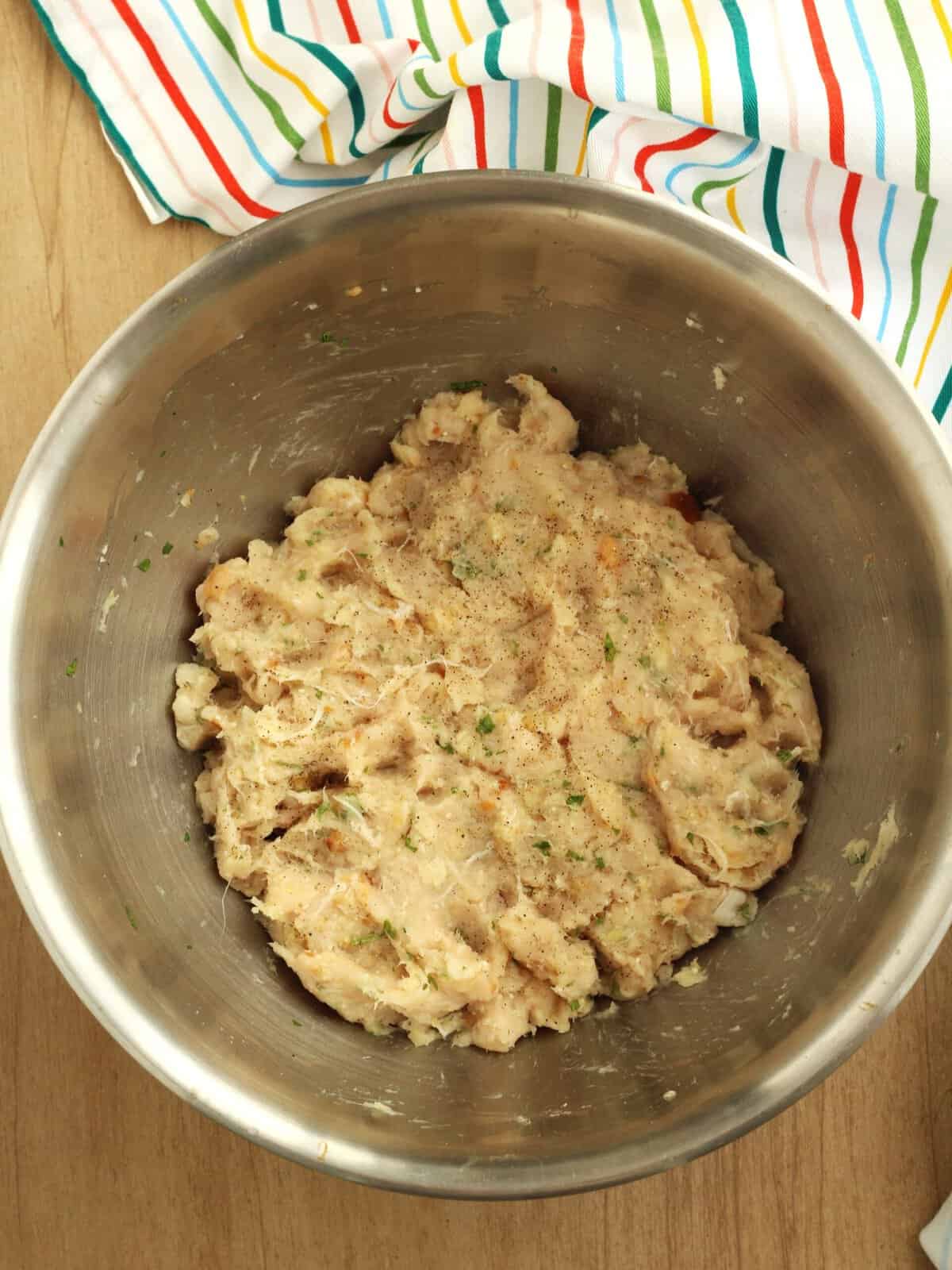 Swordfish meatball mixture in large bowl.