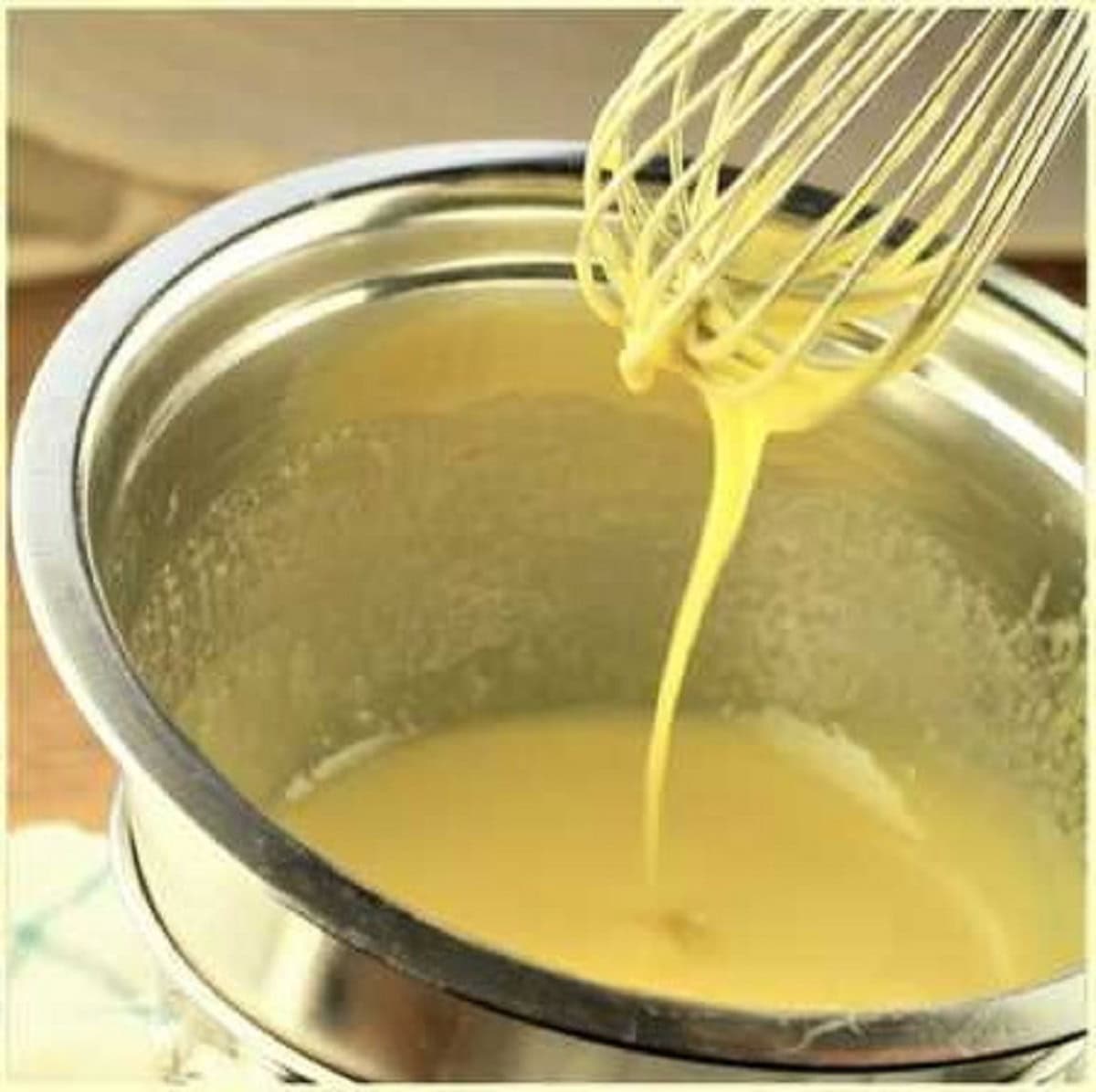 Egg yolks whisked over double boiler for tiramisu recipe.