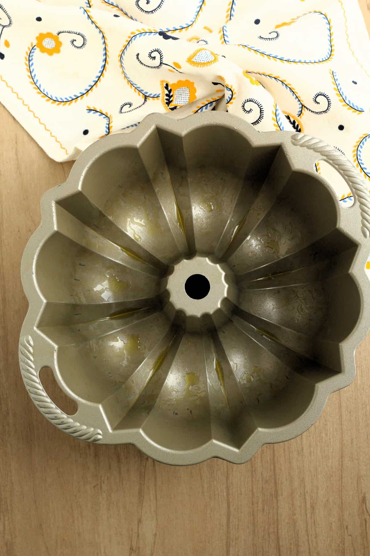 Bundt pan greased with olive oil for savory ring cake recipe.