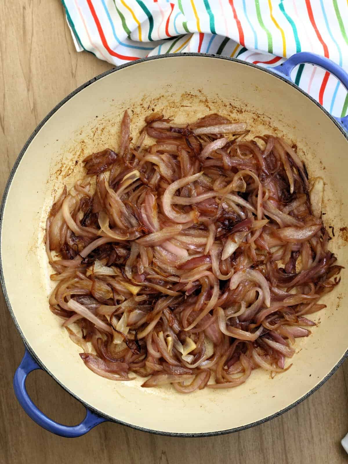 Browned onions in large skillet for agrodolce sauce.