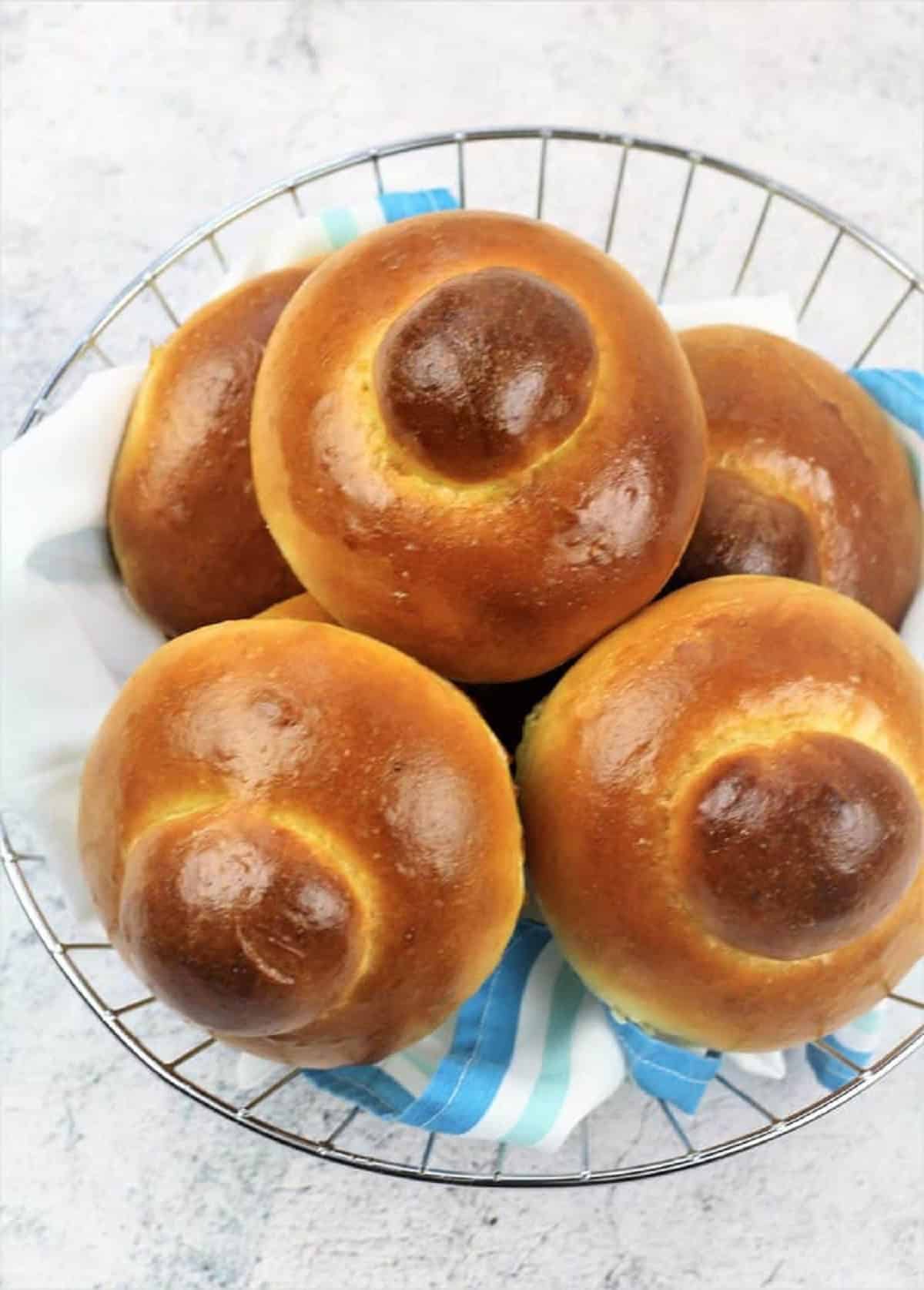 Sicilian brioche piled in wire basket.