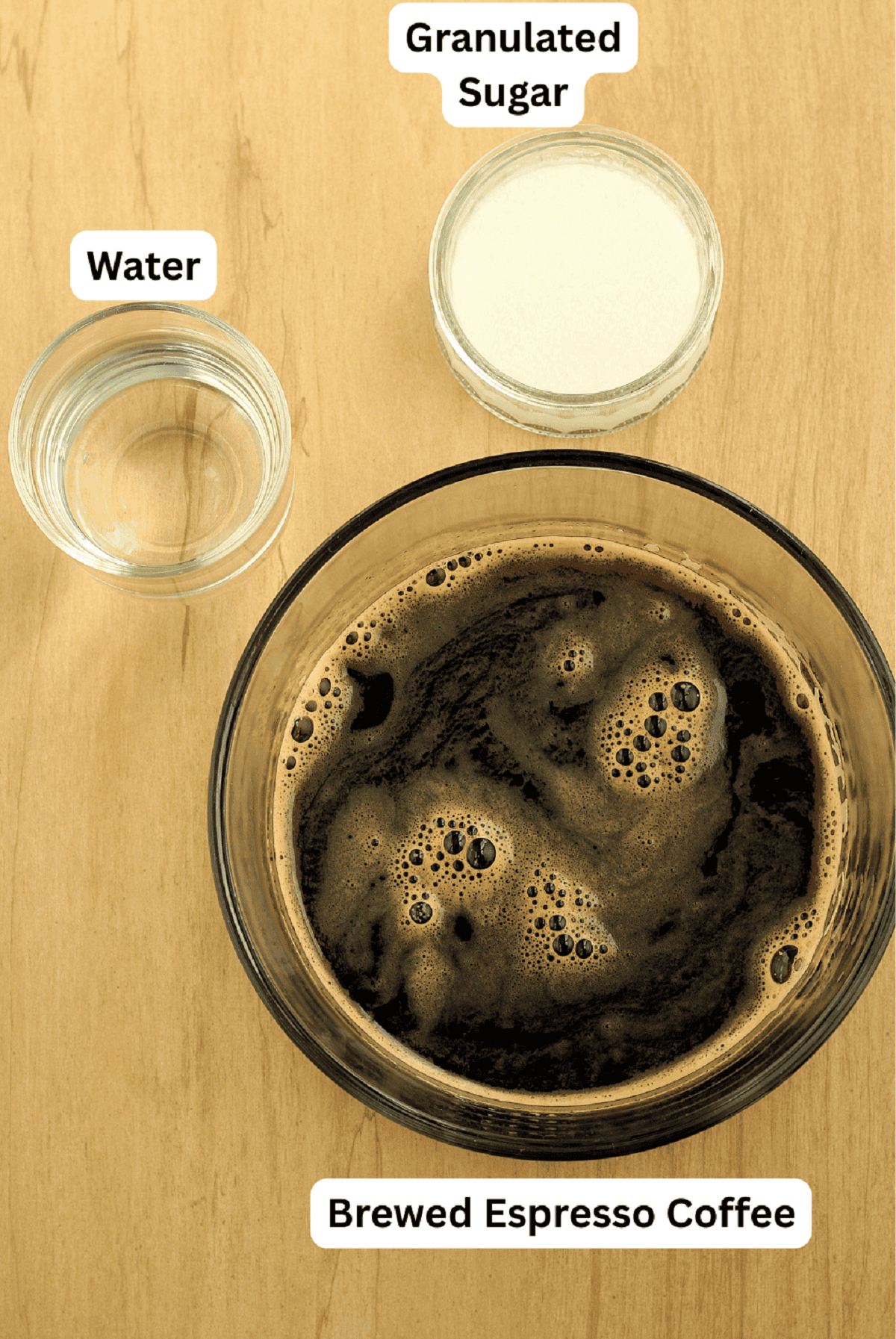 Brewed espresso coffee, sugar and water for coffee granita recipe.