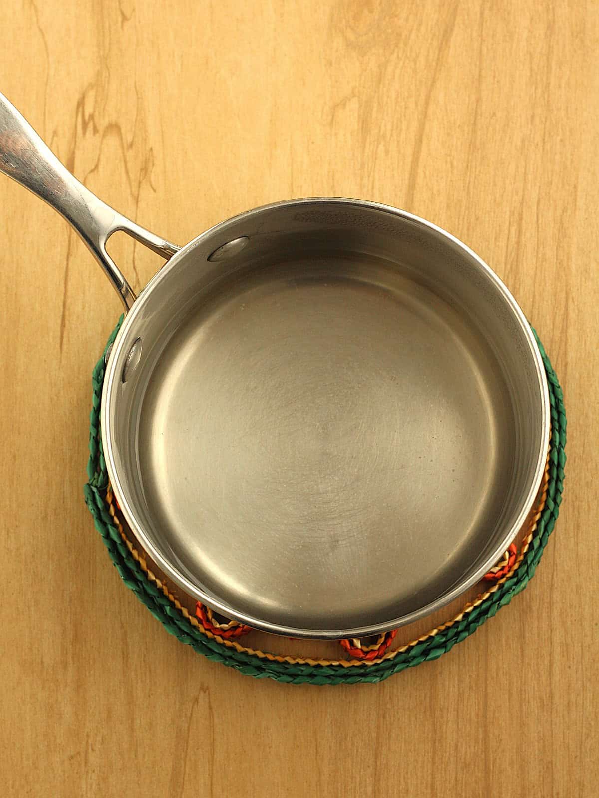 Simply syrup in small sauce pan for coffee granita recipe.
