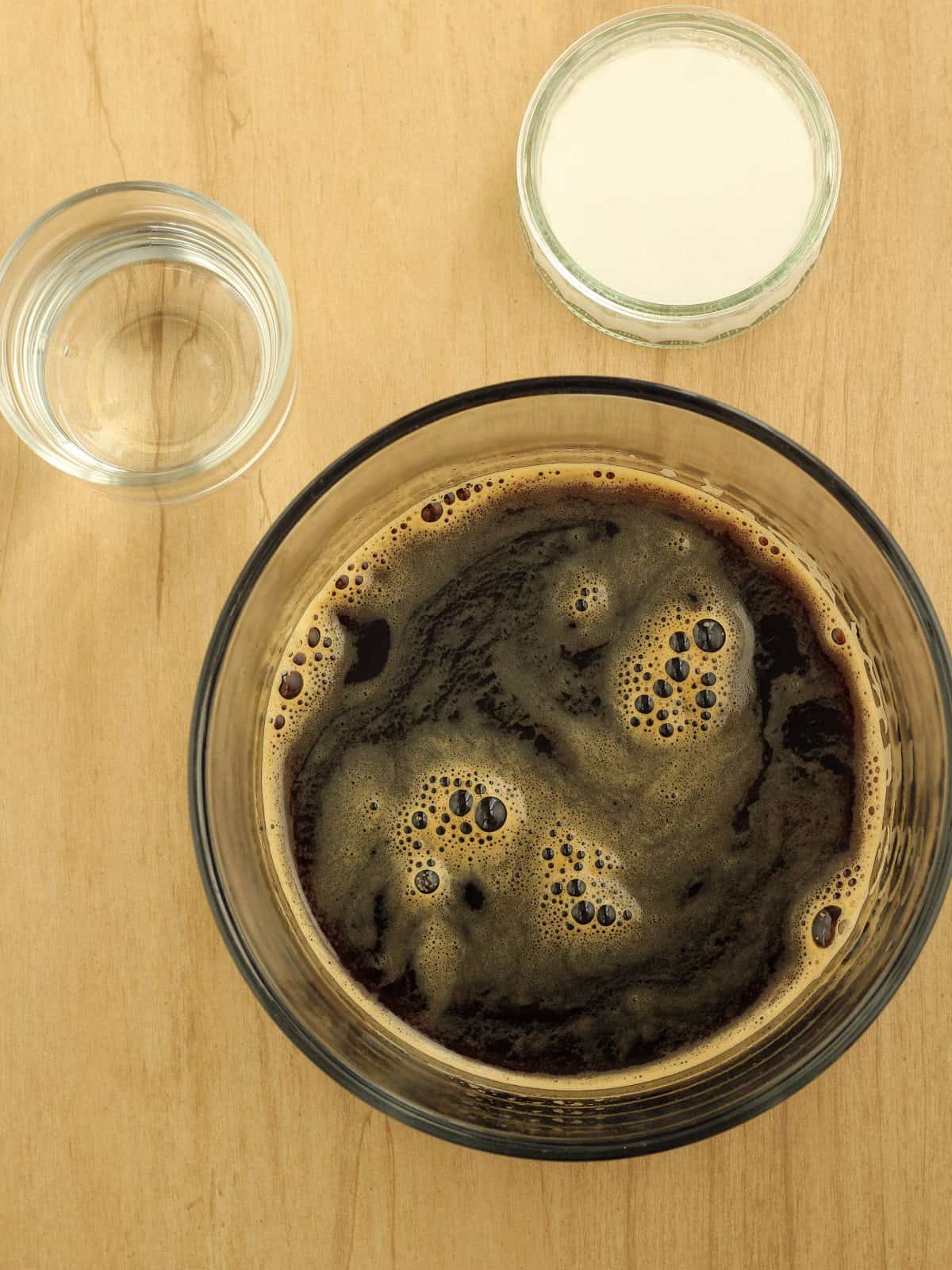 Brewed espresso coffee in glass bowl for granita recipe.