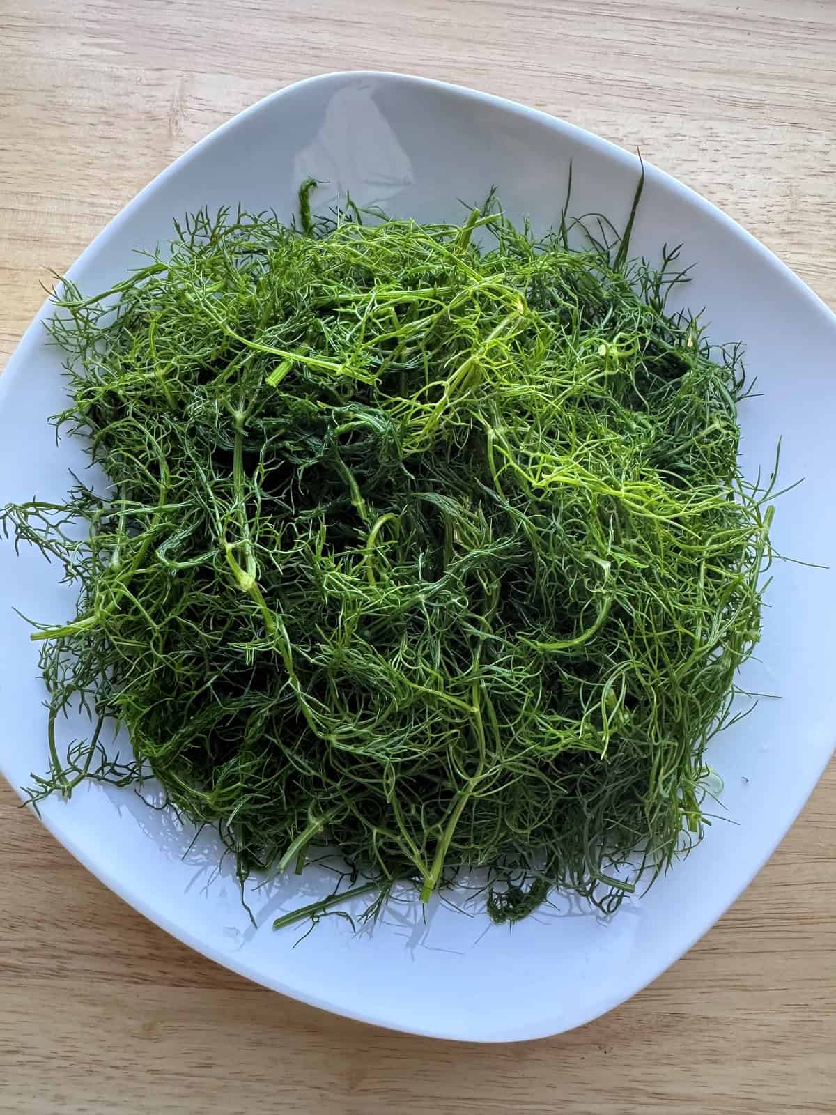 Boiled wild fennel in a bowl.