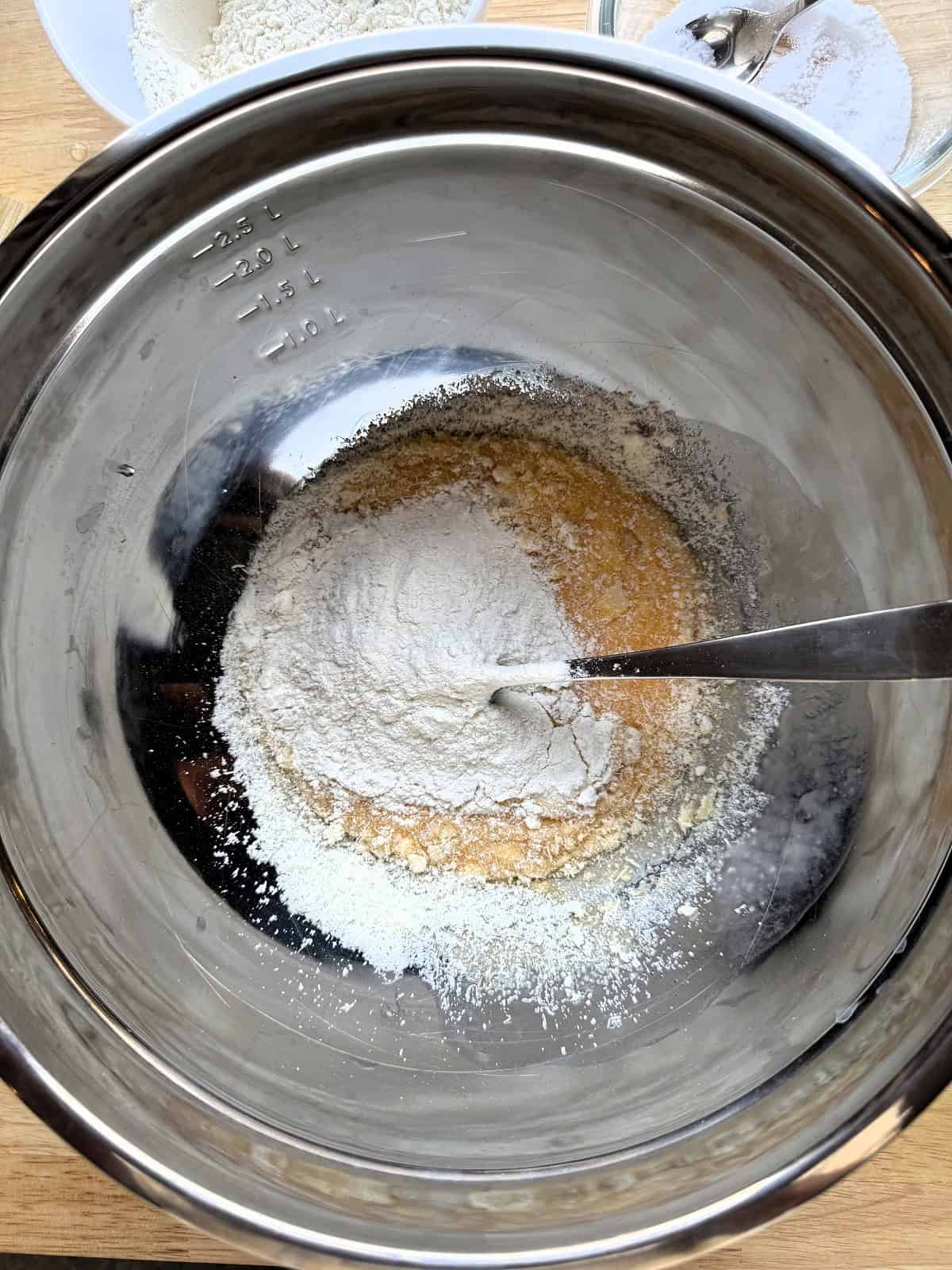 Beaten eggs with grated Parmigiano cheese and flour added for fritters batter.