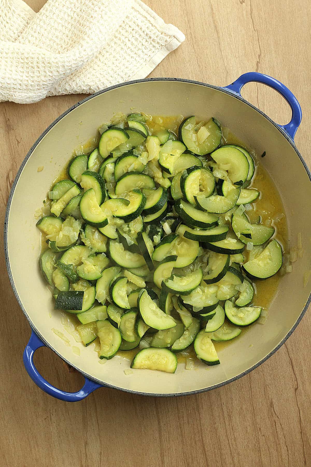 Sautéed zucchini and onion until softened in large skillet.