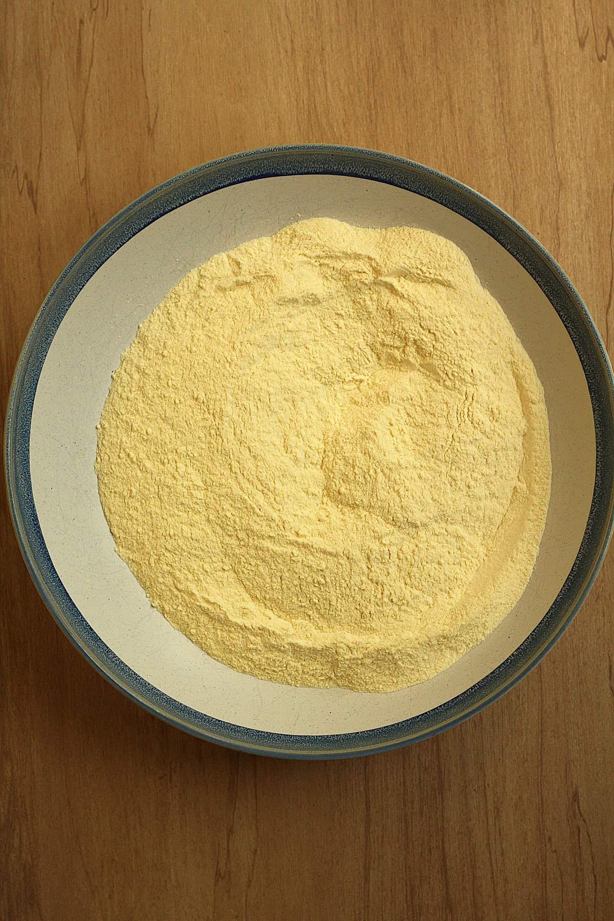 Double milled semolina flour and salt mixed in large bowl for scaccia dough.