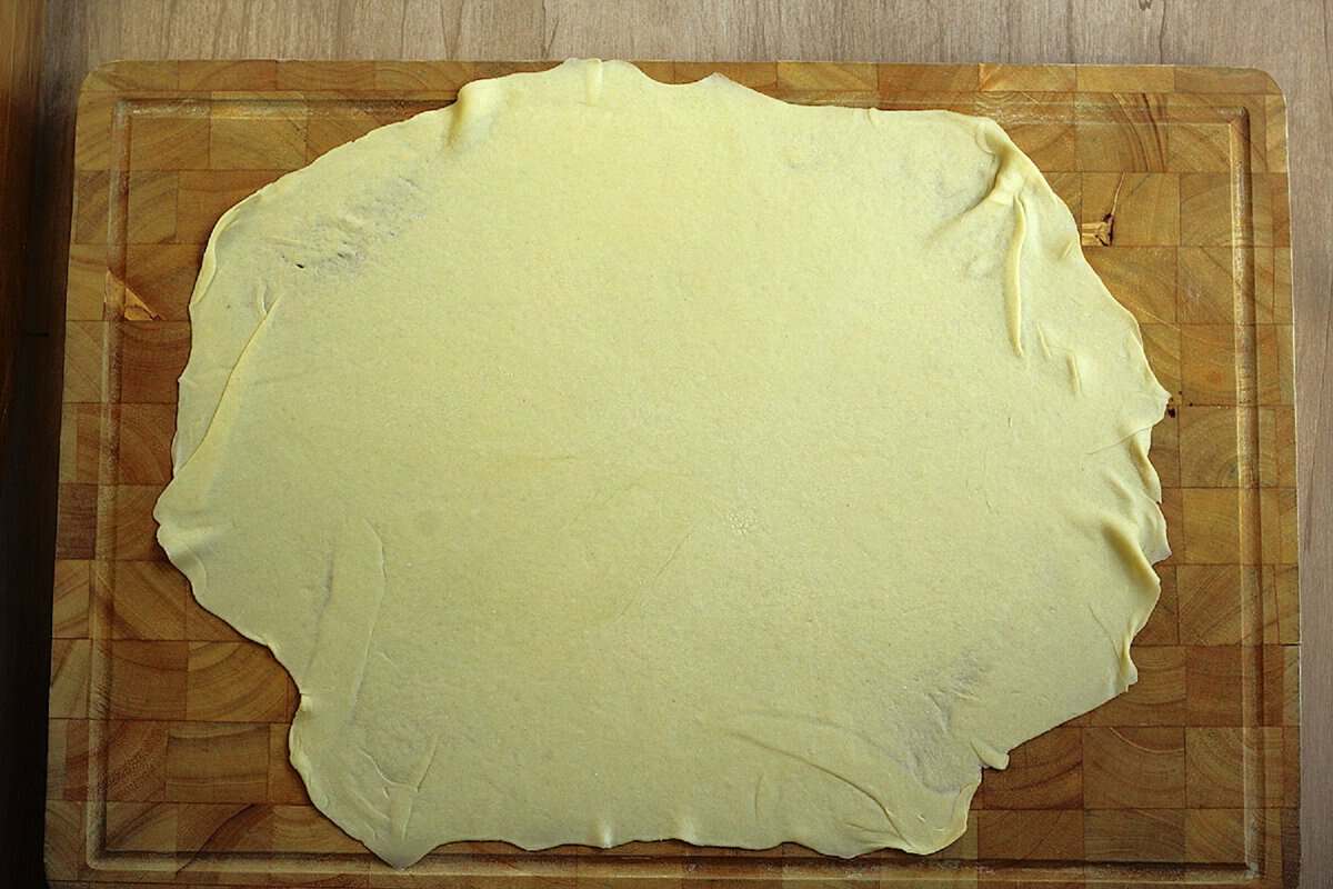 Semolina dough rolled into thin rectangular shape for scaccia recipe.