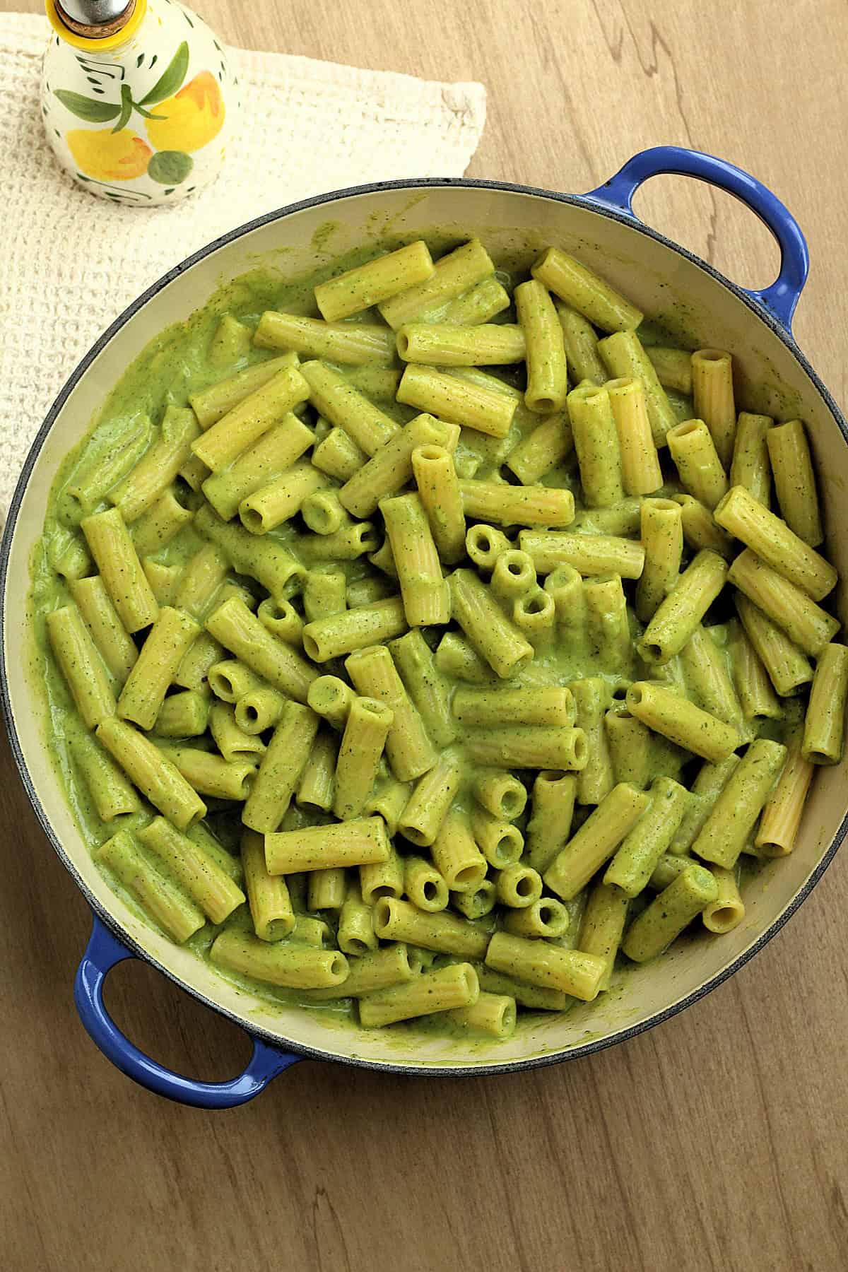 Pasta tossed with zucchini pesto in large skillet.