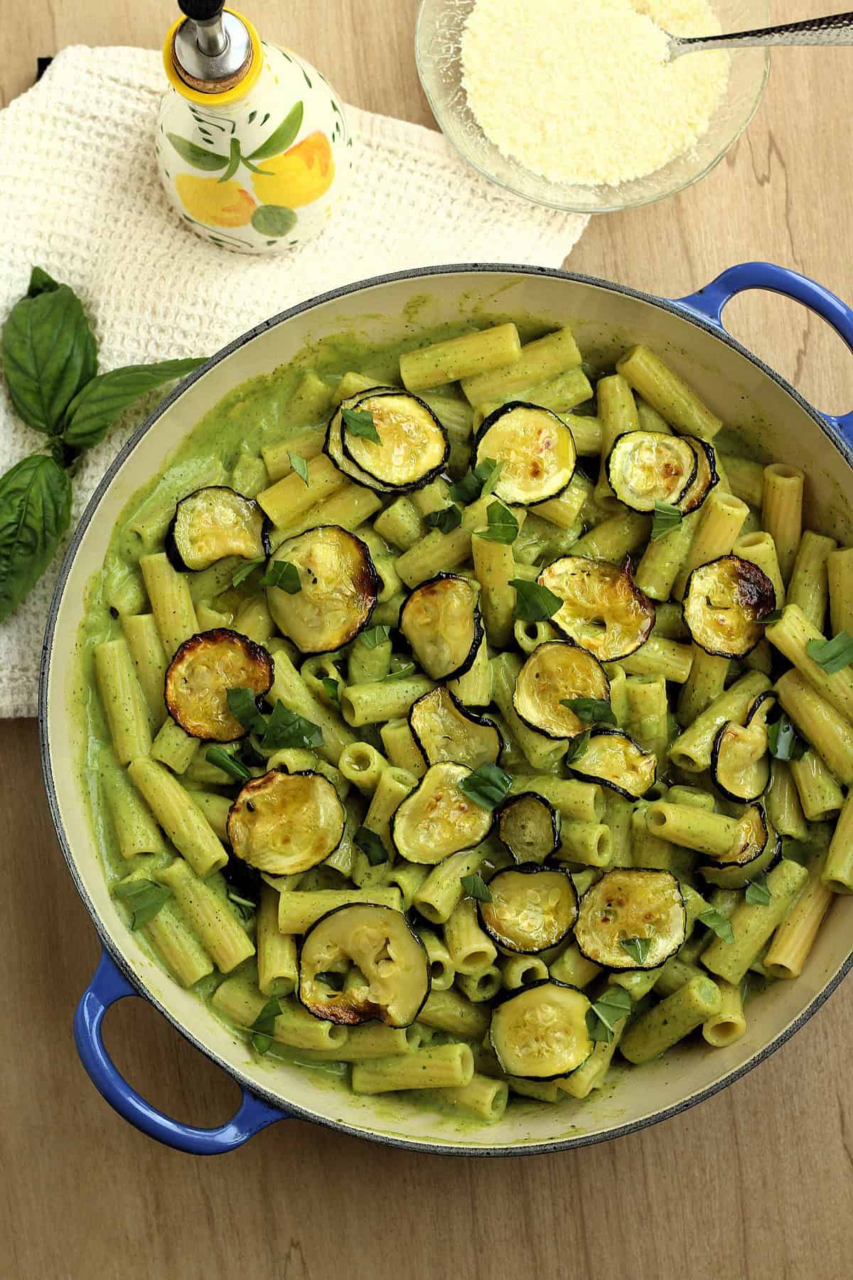 Large skillet filled with pasta with zucchini pesto and roasted zucchini.