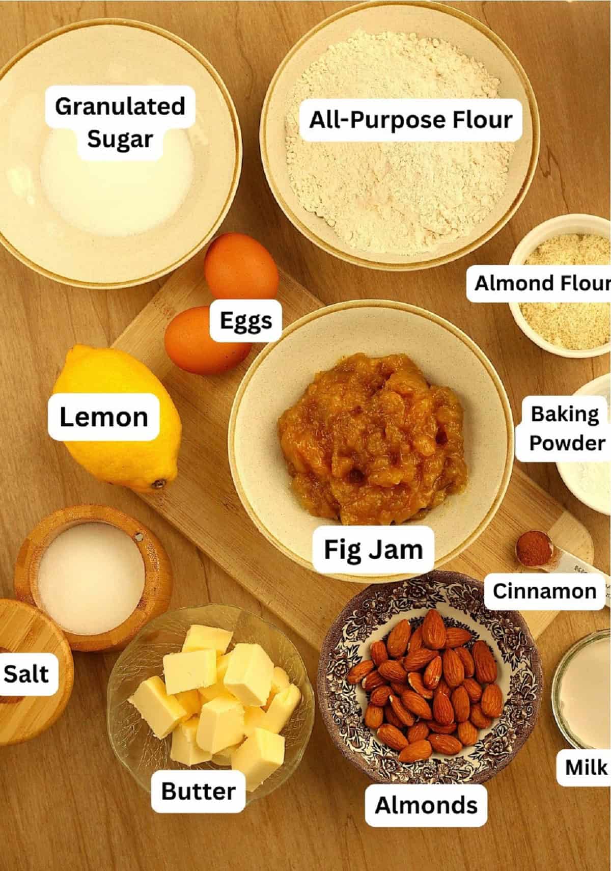 Ingredients for shortbread dough cookies filled with fig jam and almonds.