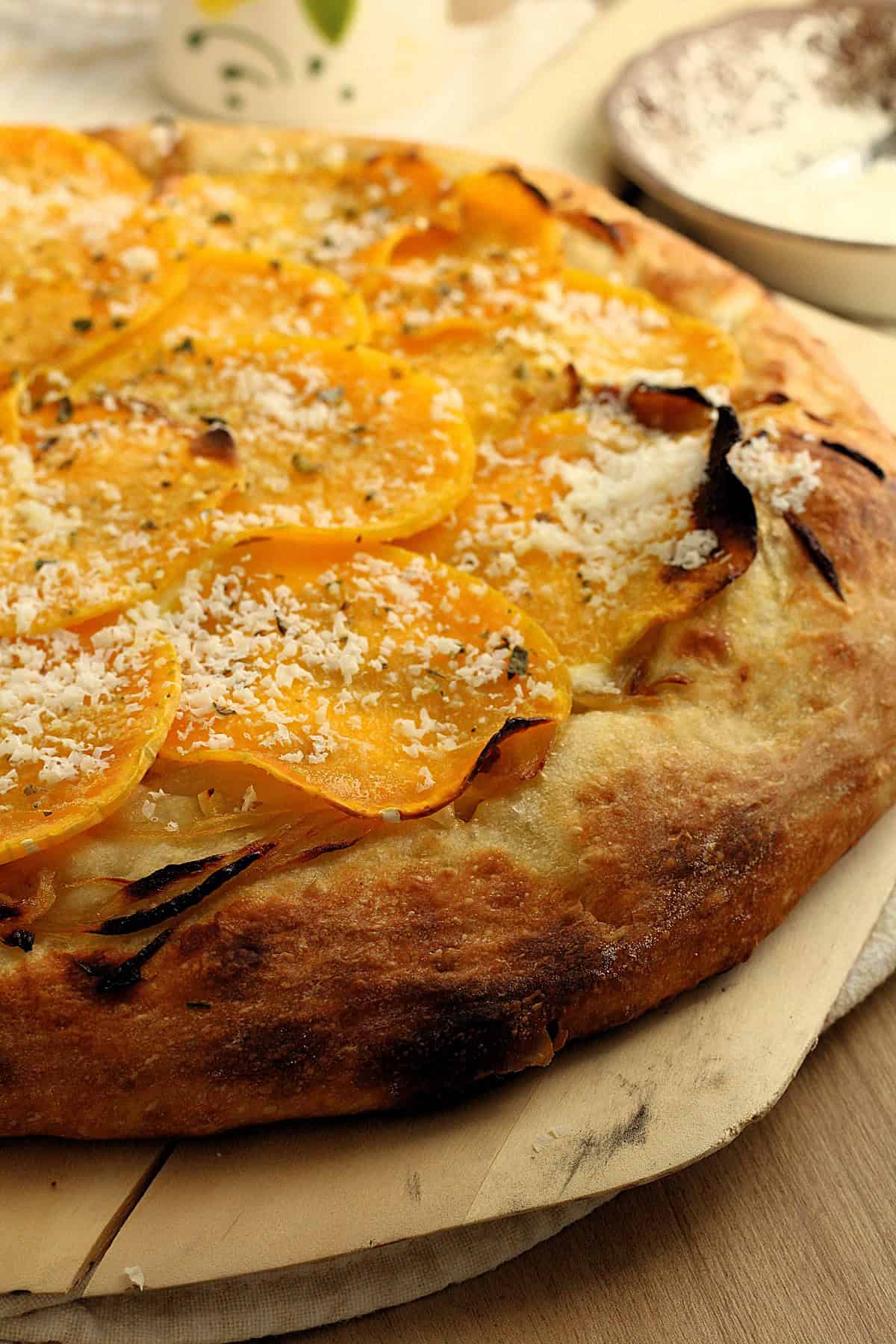 Pizza with butternut squash, caramelized onions and ricotta salata.