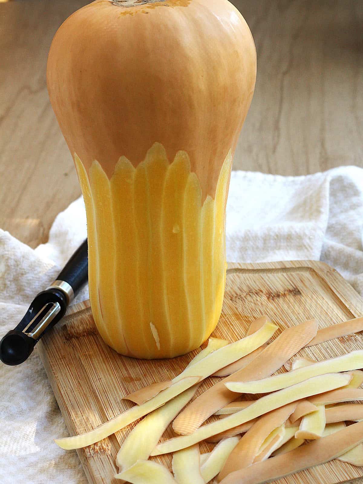 Butternut squash peeled with a vegetable peeler.
