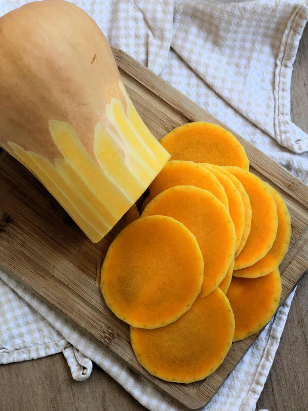 Butternut squash thinly sliced rounds for pizza topping.